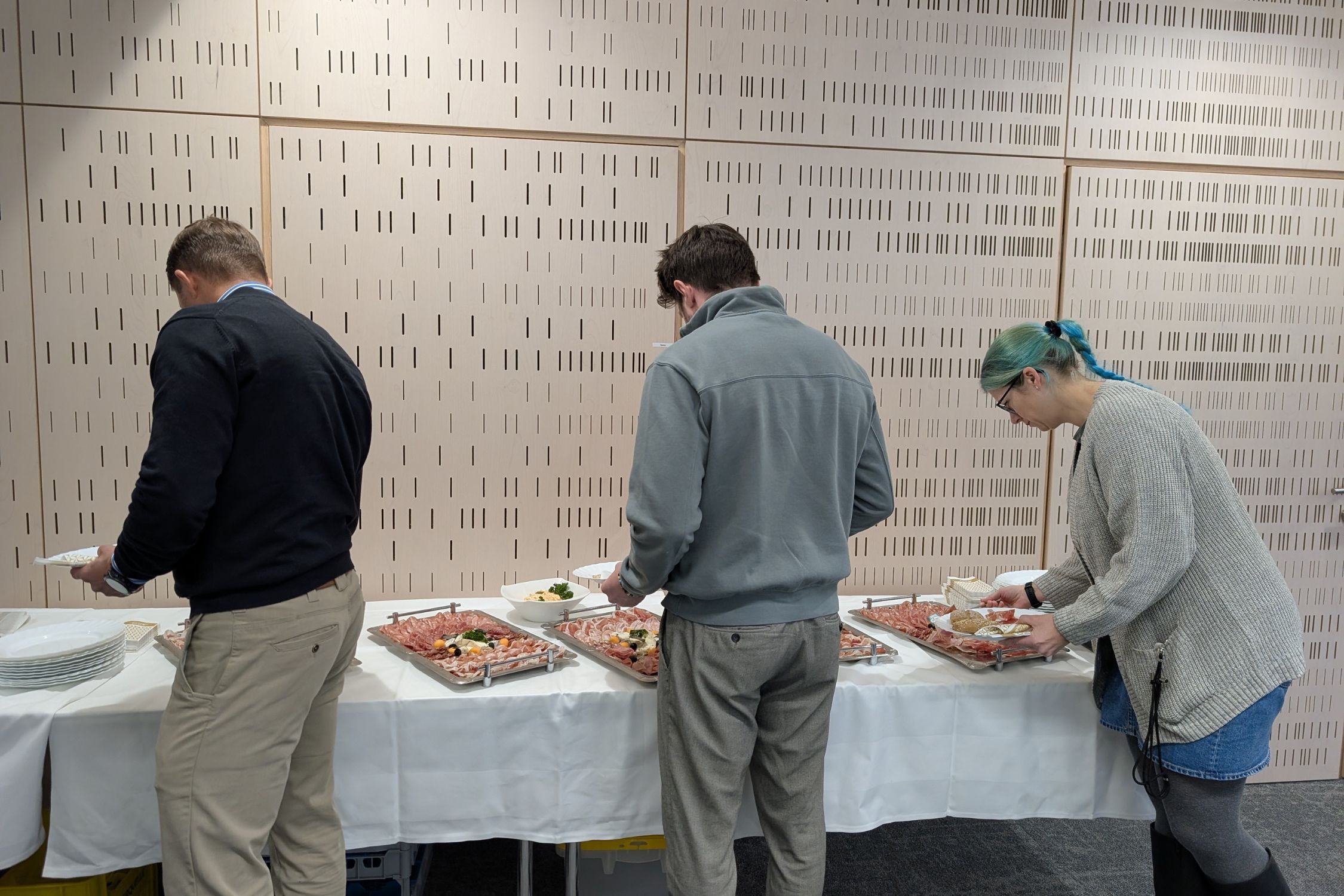 Business Breakfast participants line up at the breakfast buffet