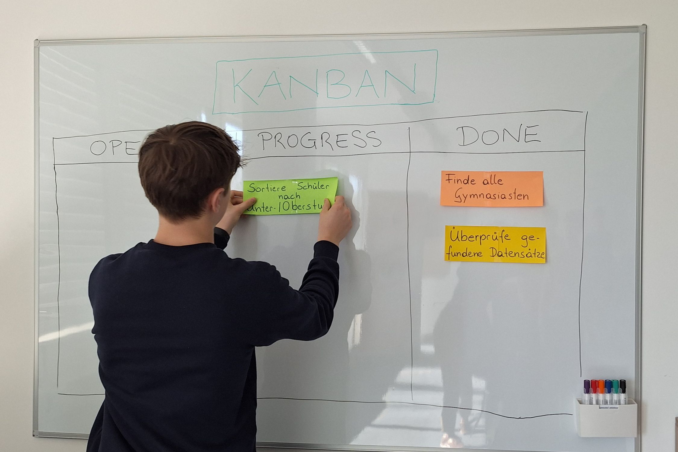 student working on the blackboard