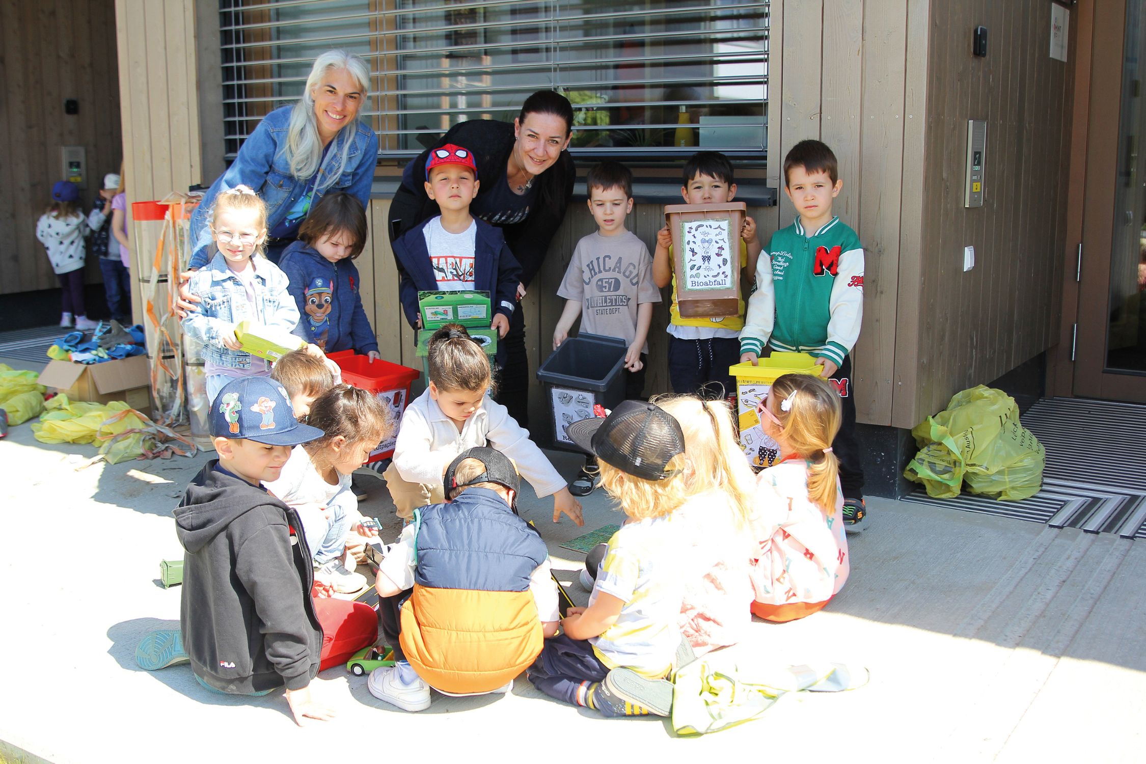 Kindergarten children learn about waste prevention and waste separation