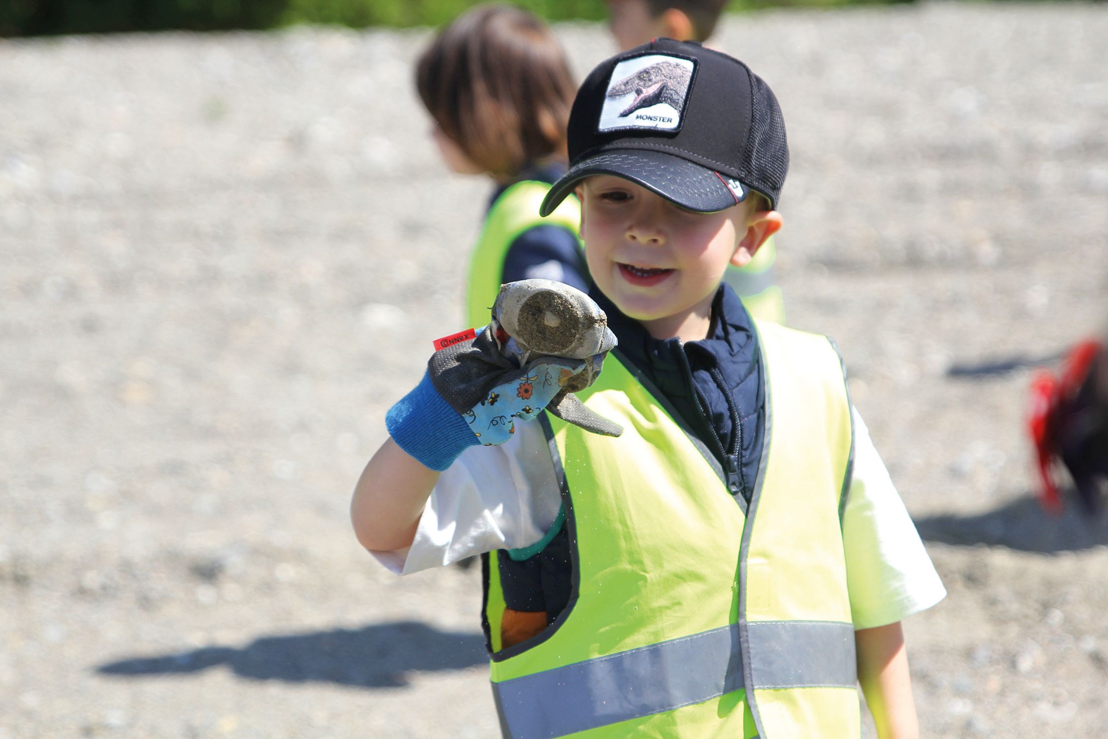 A boy is helping to collect trash