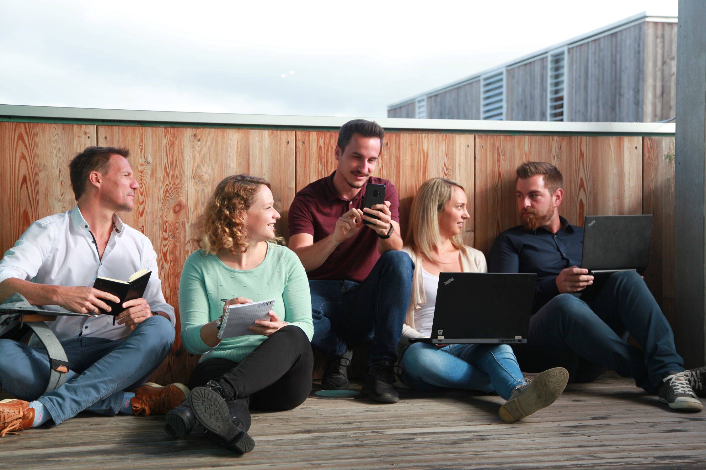 addIT Team chilling on the balcony